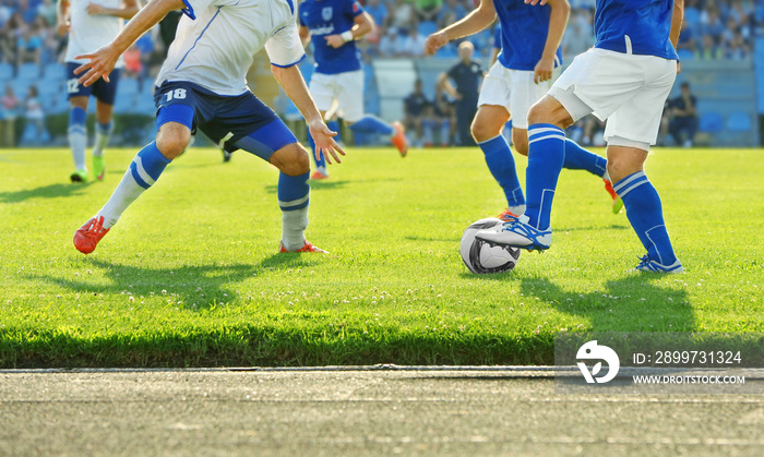 Football match in sunny summer day