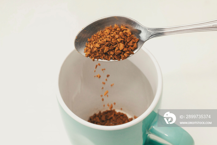 Instant coffee on spoon