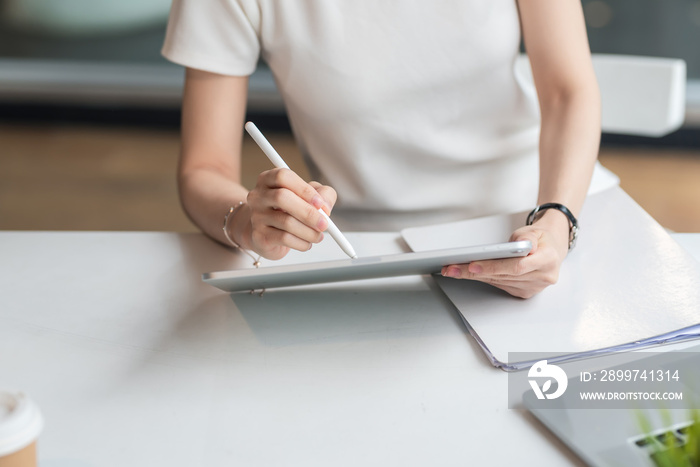 person working on tablet computer