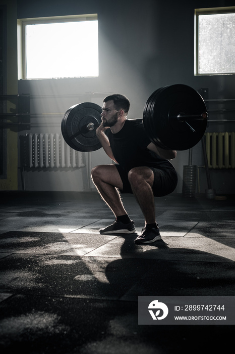 Concentrated Male Do Squat Exercise With Barbell .