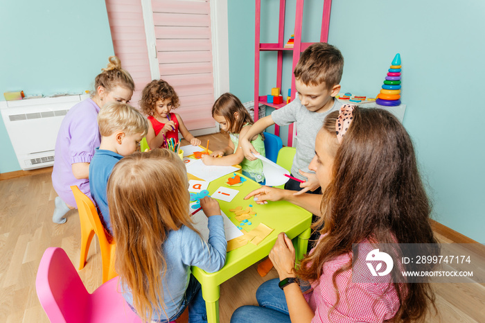 Preschool children learn english alphabet using cards