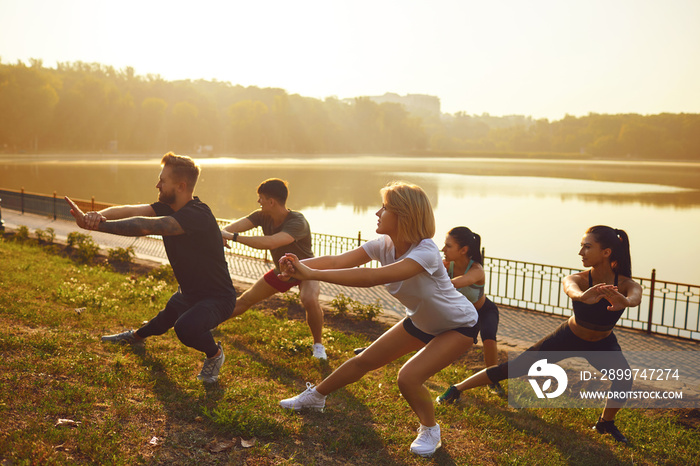 Group of young people at a training session in a park