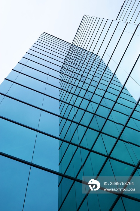 Glass Shrouded Building - Modern Design - Blue Tinted Reflections.