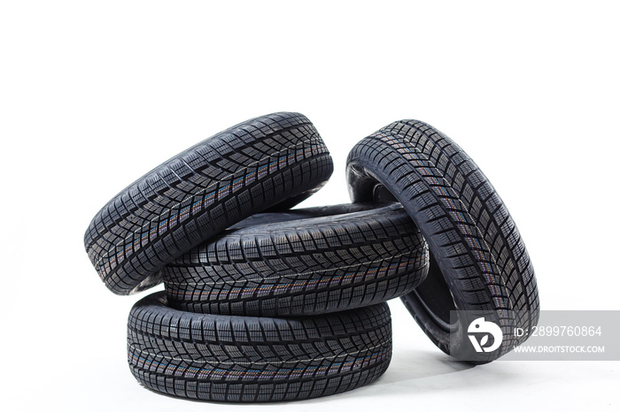 four black tires isolated on white background