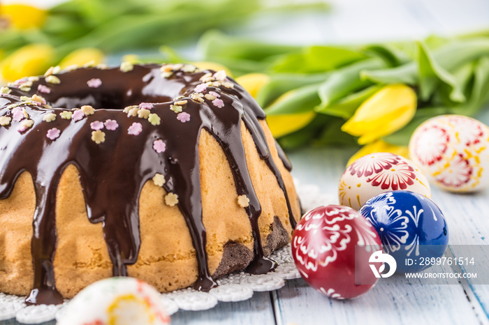 Delicious holiday slovak and czech cake babovka with chocolate glaze. Easter decorations - spring tu