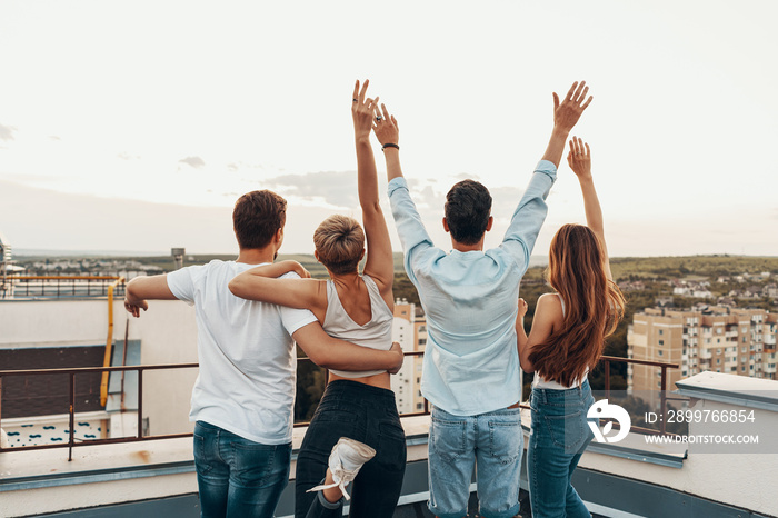 Group of friends enjoying outdoors at roof