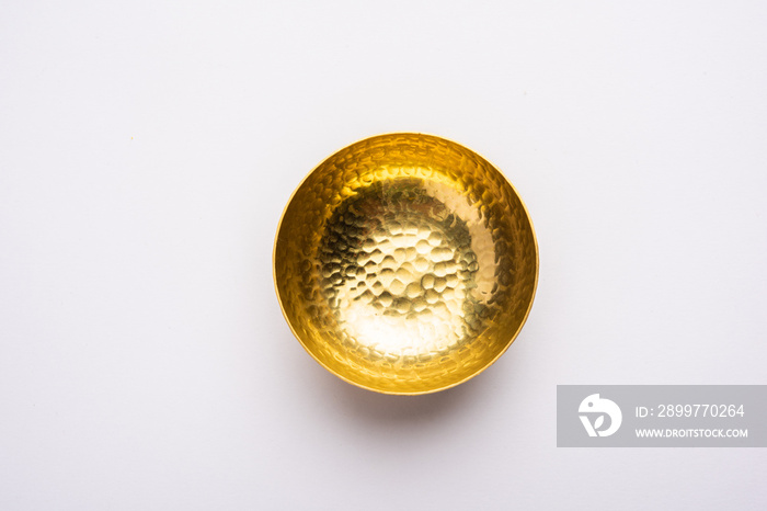 empty crockery - New brass or gold bowl over white background