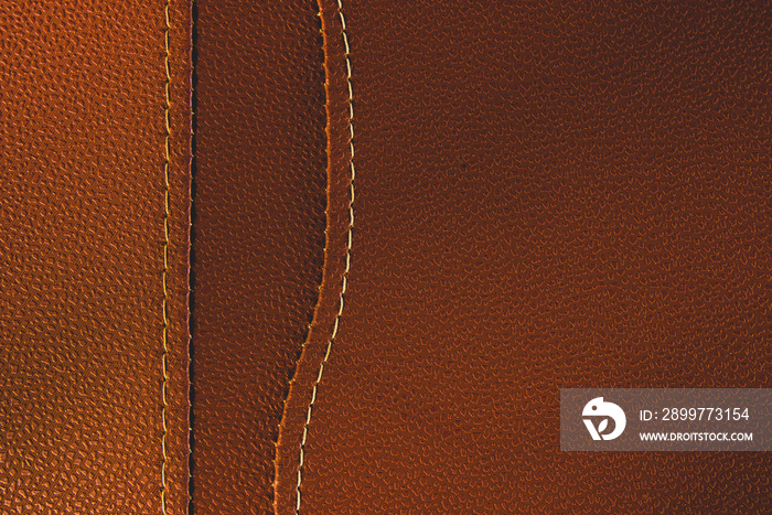 Brown leather with white stitch closeup for background.Part of leather motorcycle seat.