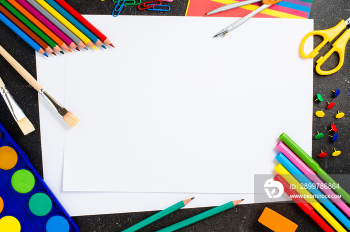 School supplies on dark table