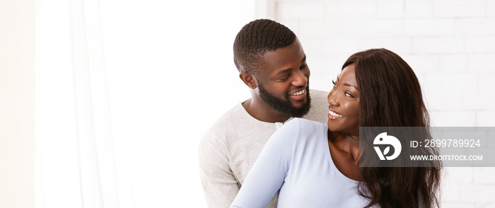 Just married afro couple posing over white background