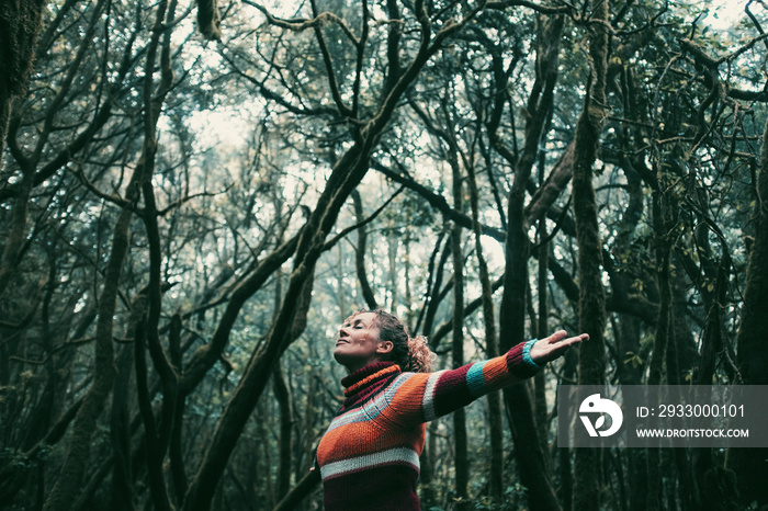 Freedom people enjoyng feeling with nature forest. Woman outstretching arms in the green woods. Leisure and ptrees protection. Earth’s day and life scenic place. Tourist in travel amazing destination