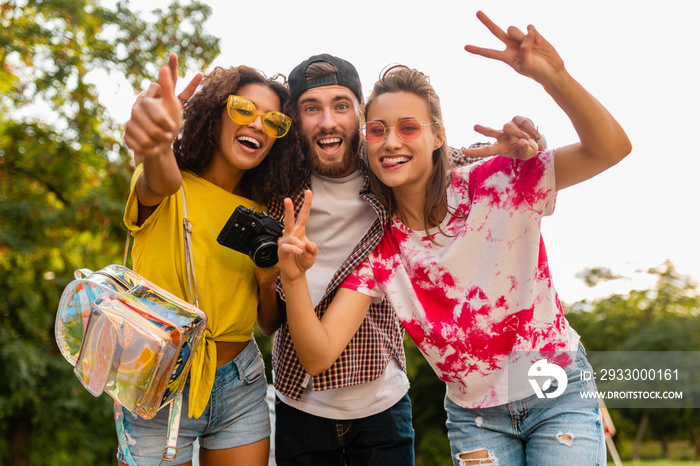 happy young company of friends having fun in park