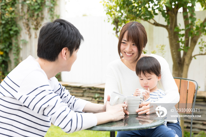 young asian family relaxing in cafe