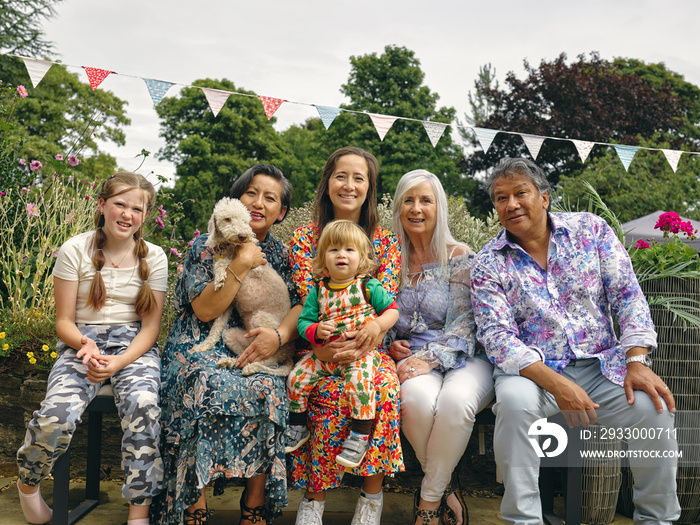 Portrait of multi-generation family with children and dog