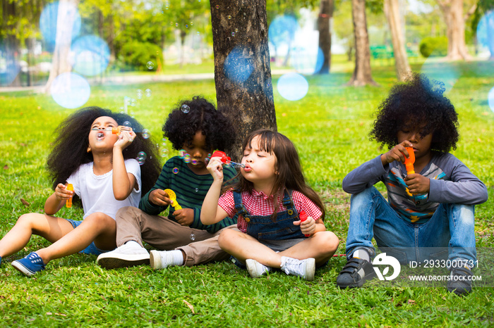 Group of Diverse Kids Playing at the garden Together