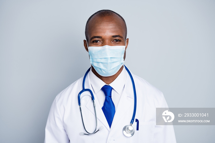 Stay home for us. Photo of family doctor dark skin guy examining patients virologist outbreak wear protective mask white lab coat blue neck tie isolated grey color background