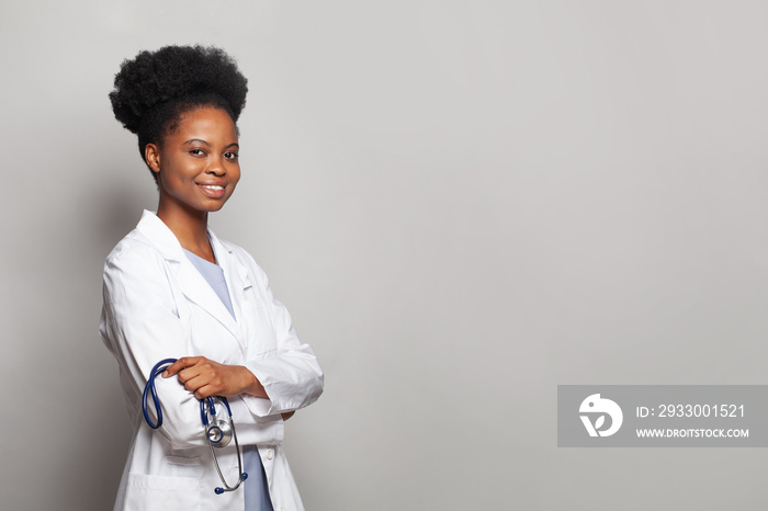 Confident female doctor medical professional smiling on white background