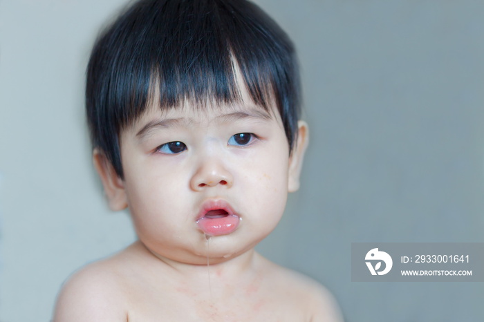 Asian baby drooling isolated on white background