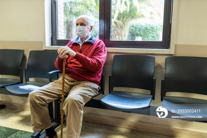 elderly man in a hospital with respirator