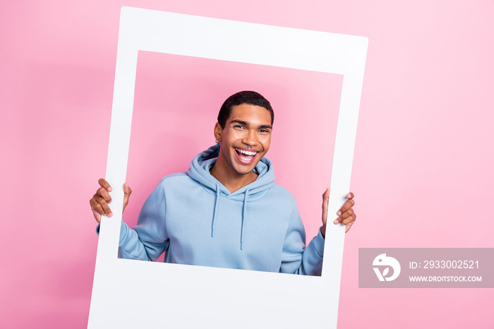 Photo of young blogger funky handsome student man hold paper frame shooting video memory remember holiday event isolated on pink color background