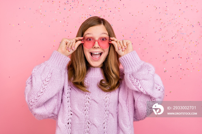 Photo of young excited cheerful girl reaction omg glad festive yell heart figure isolated over pink color background