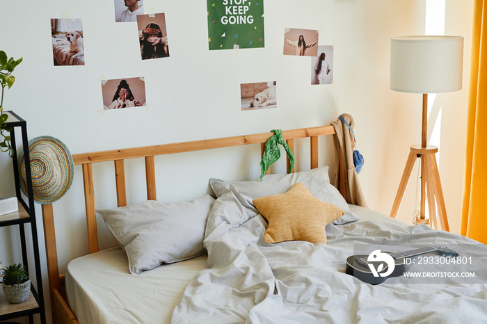 Background image of cozy teenage bedroom interior with a lot of accessories and ukulele on comfortable bed, copy space