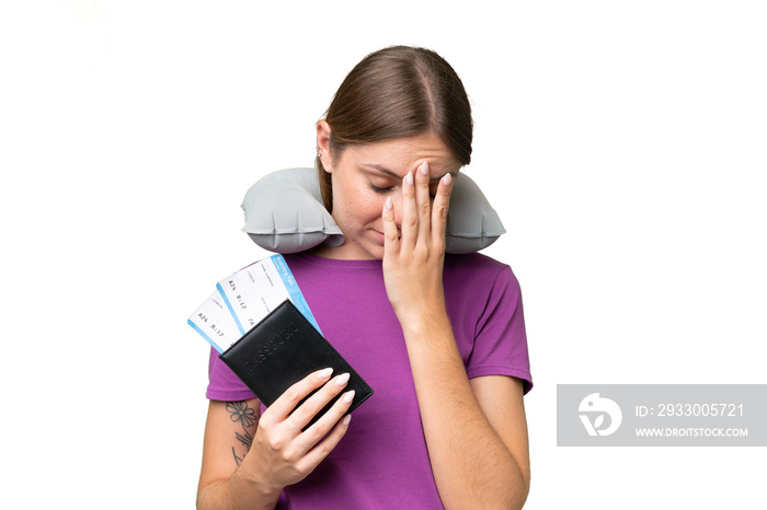 Young beautiful blonde woman with Inflatable travel Pillow over isolated background with tired and sick expression