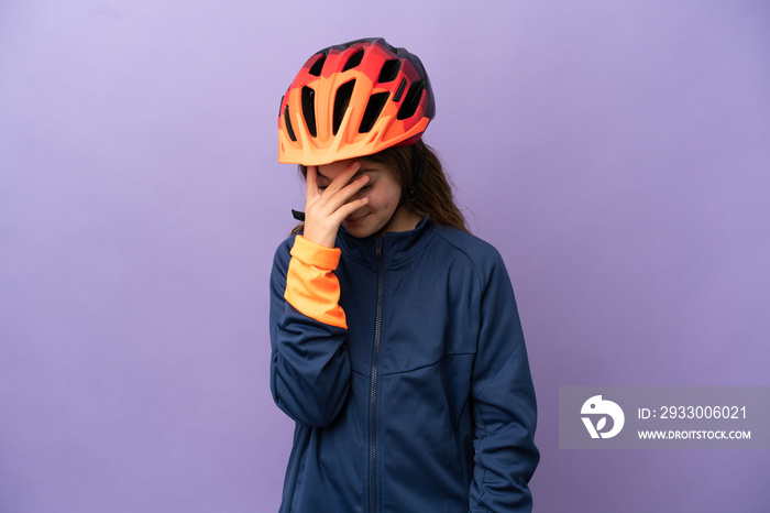 Little caucasian girl isolated on purple background laughing