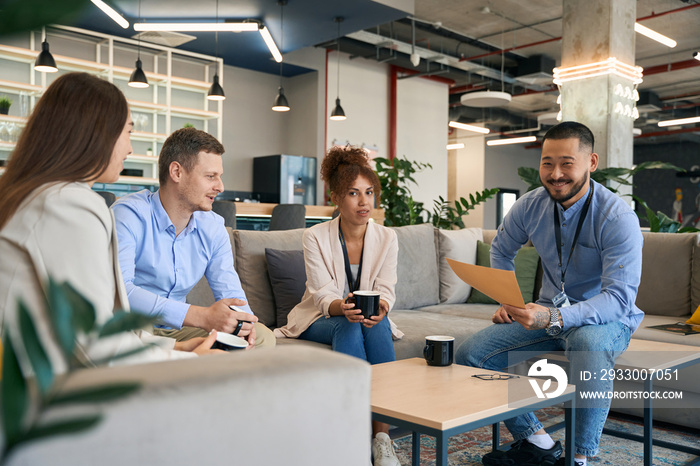 Businessman holding meeting with business partners in co-working space