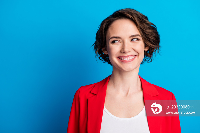 Close-up portrait of nice attractive cheerful brown-haired lady looking aside copy space isolated on bright blue color background