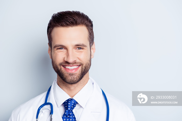 Close up portrait of happy smiling doctor in uniform isolated on white background