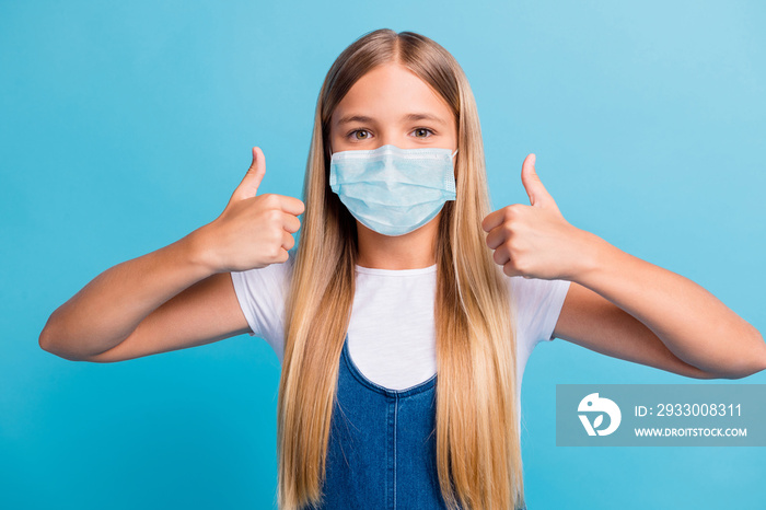 Photo of nice blond long hair girl thumbs up wear facial flu mask white t-shirt isolated over pastel blue color background