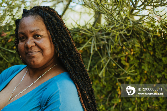 closeup of a plus size afro latinx haitian American woman looking at camera