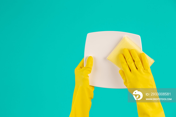 The concept of dishwasher wearing yellow gloves on a blue background.