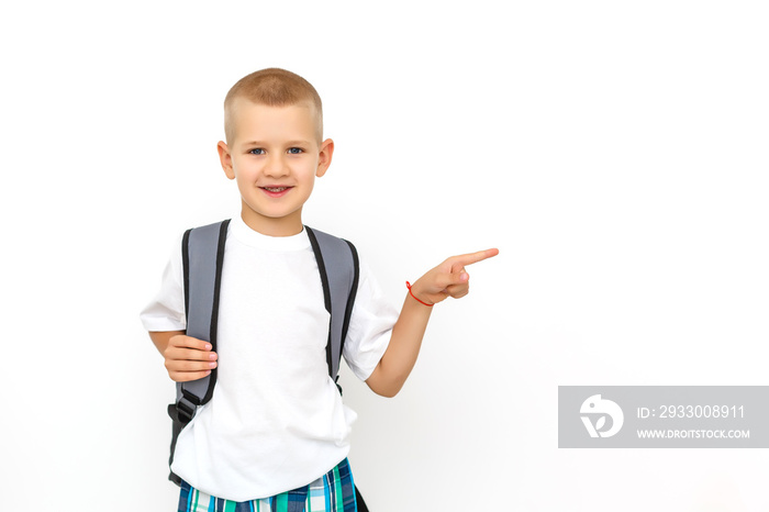 portrait of male elementary pupil on white