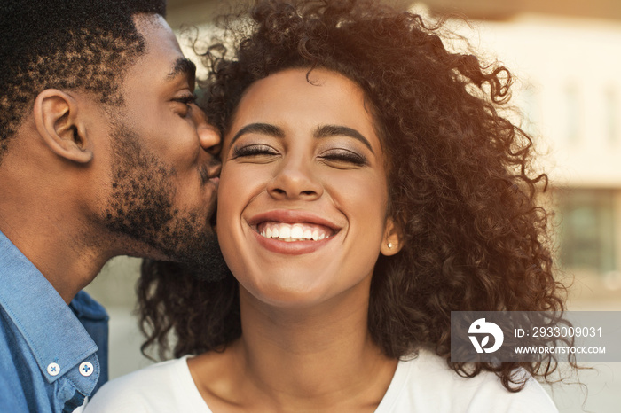 Couple in love. Boyfriend kissing his girl