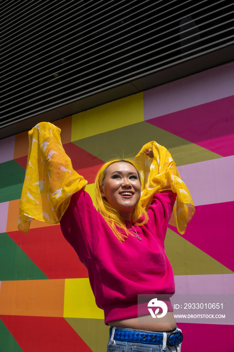 Smiling young woman with yellow hair