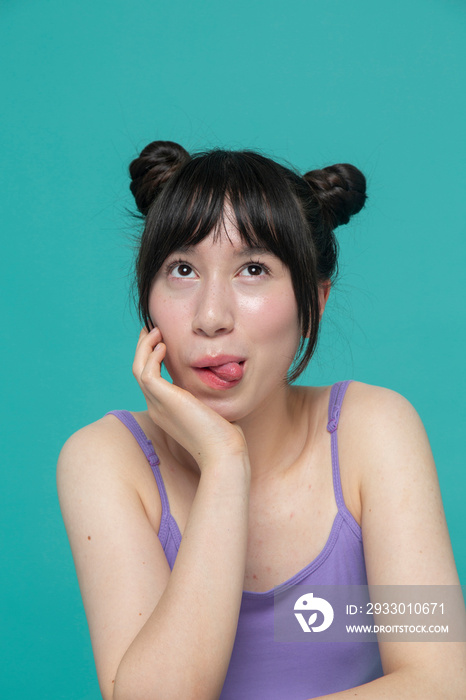 Studio portrait of girl making faces