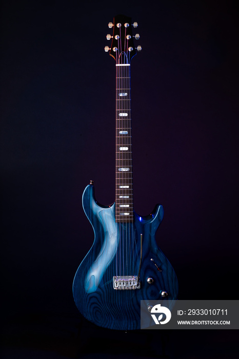 Electric Guitar, dark blue woodgrain, 6 String isolated on black