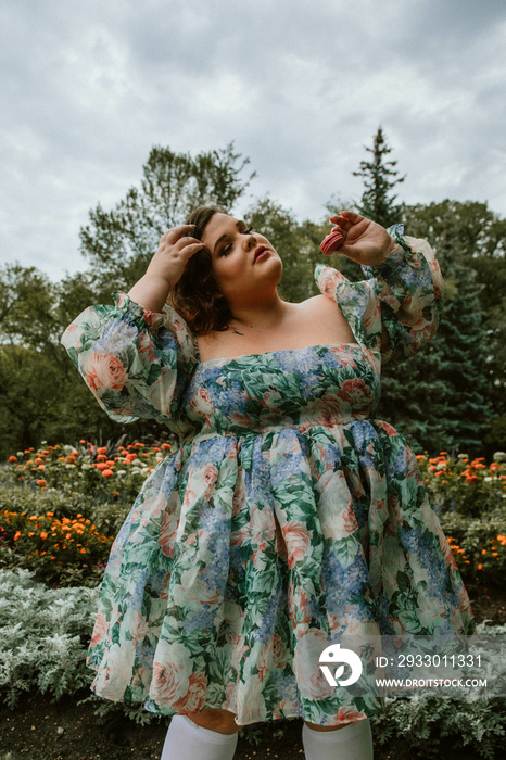 portrait of a plus size woman eating macarons