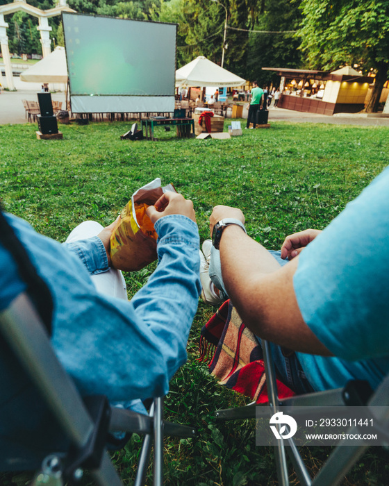 eating snacks drinking beer movie in open air cinema