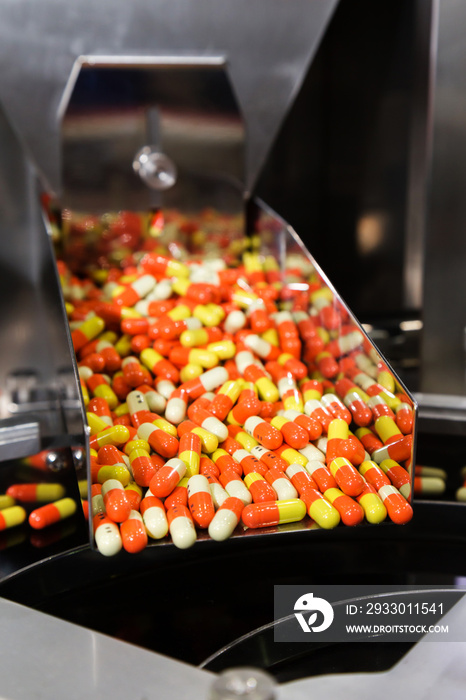 pharmacy medicine capsule pill in production line at medical factory. selective focus.