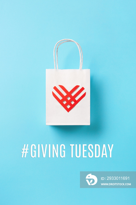 Giving Tuesday, global day of charitable giving after Black Friday shopping day concept on blue background.