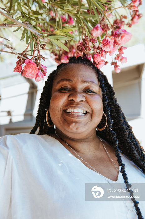 close up portrait of a plus size afro latinx haitian american woman smiling