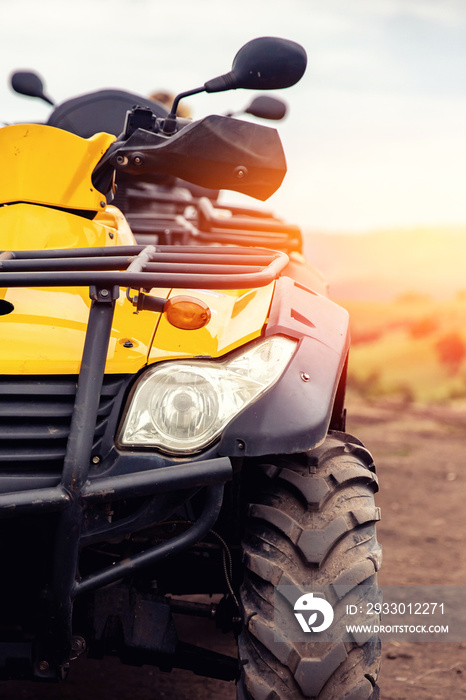 ATV quad bike on forest offroad, front view, sunlight