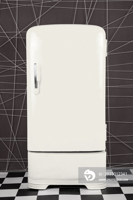 old vintage white refrigerator on a deep background