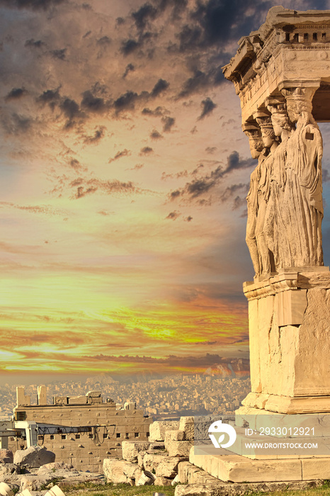 Caryatids nymphs statues on Acropolis of Athens and dramatic sky during sunset, Greece