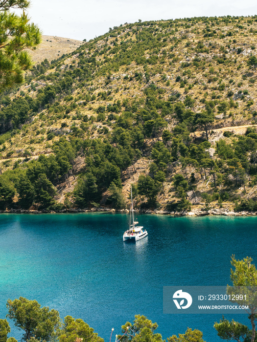 Scenery with turquoise remote beaches, plants and hills in Brac Island, Croatia