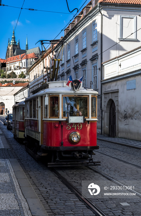 Vintage Tramway In Narrow Street In Front Of Hradcany Castle And Saint Vitus Cathedral In Prague In The Czech Republic