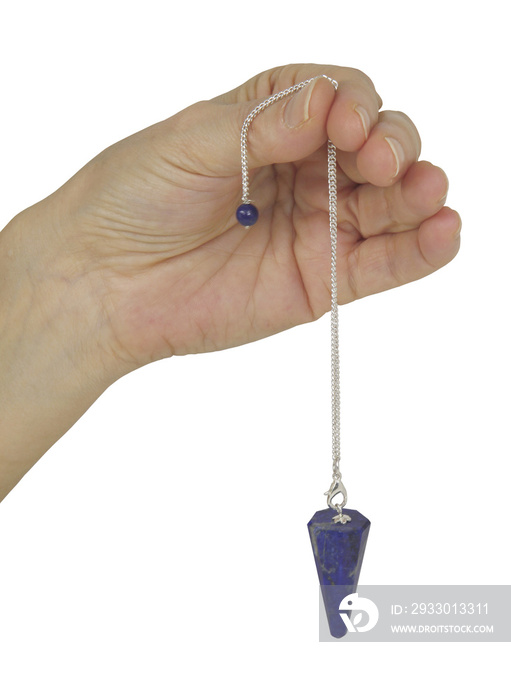 Holding a Lapis Crystal Dowsing Pendulum -  female hand holding a dark blue pendant on a white background preparing to Dowse